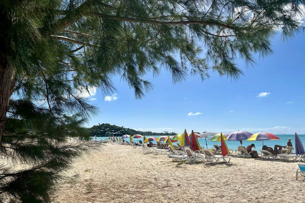 Jolly Harbour beach in Antigua with people safe on the beach