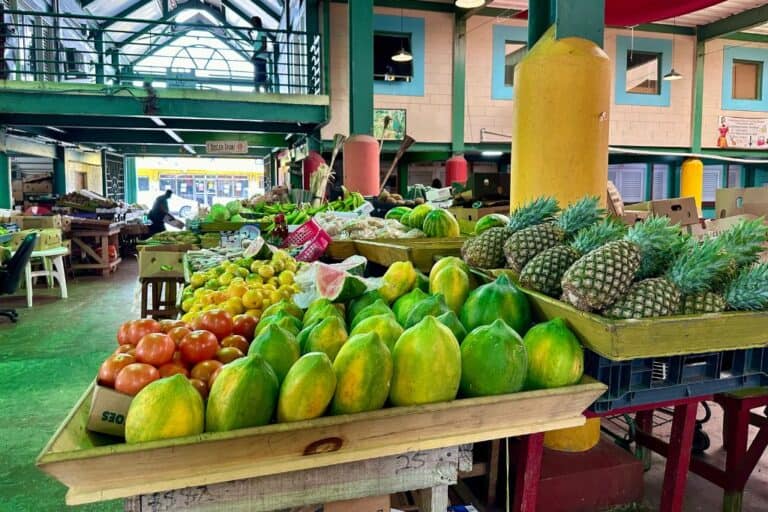 food market with bananas and mangoes