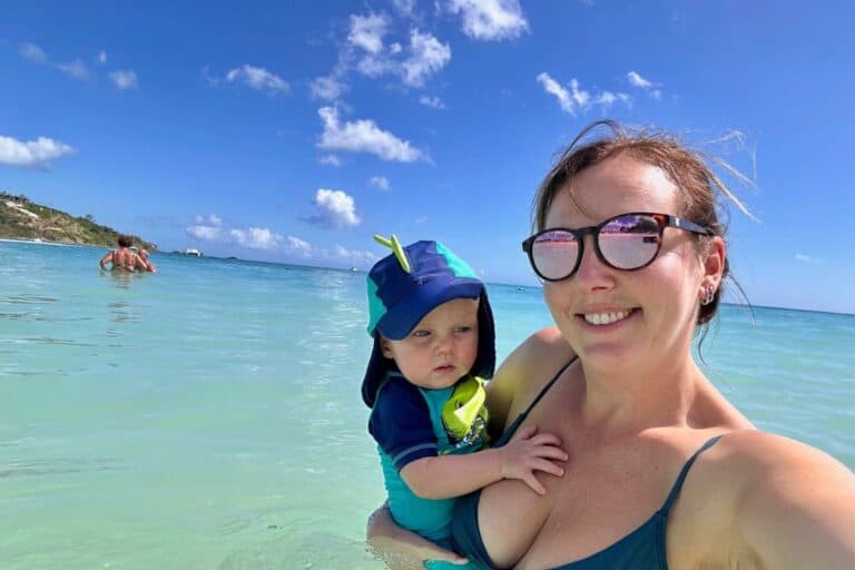 mother with her baby in the water in Antigua