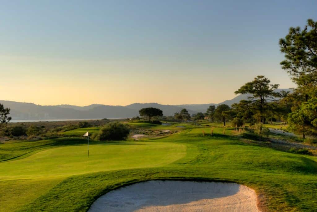 The view of the Troia golf course with the ocean in the background.