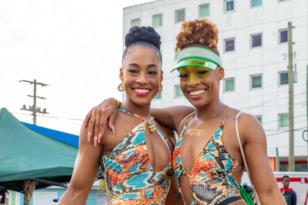 Two ladies in bodysuits are Antigua Carnival
