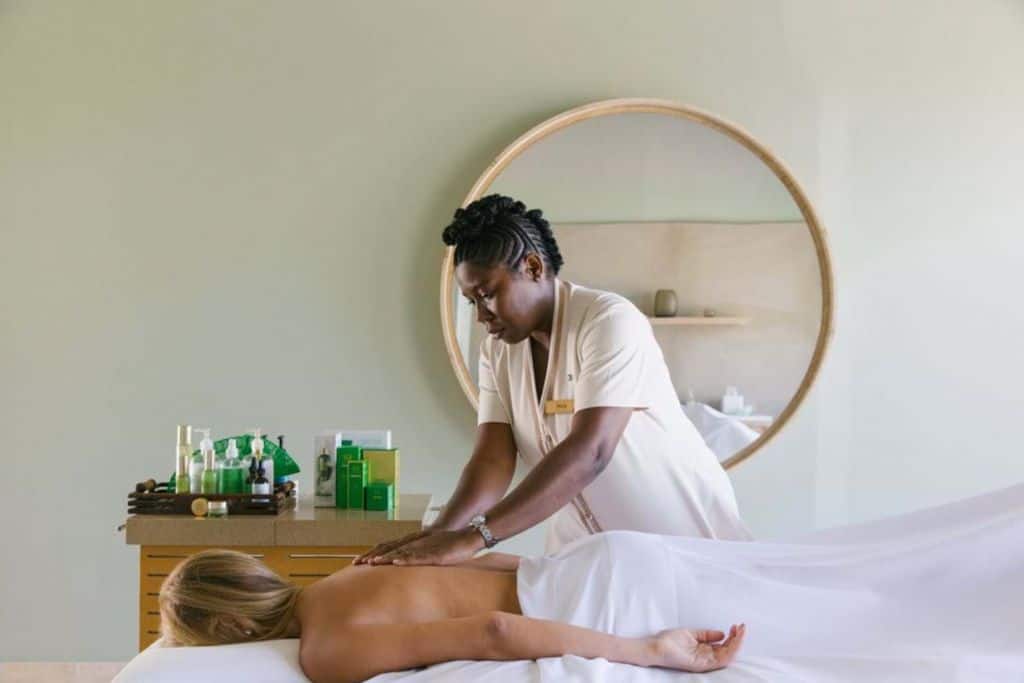 Lady having a spa massage with  female spa therapist.
