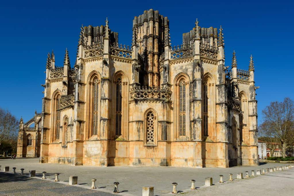 The facade of the main monument in Batalha which is the convent.  It is made up of stone bricks.