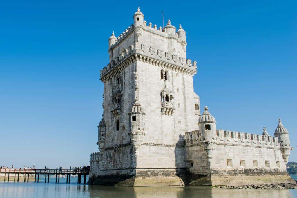 The Belem Tower in the river with its beautiful intricately carved exterior facade.