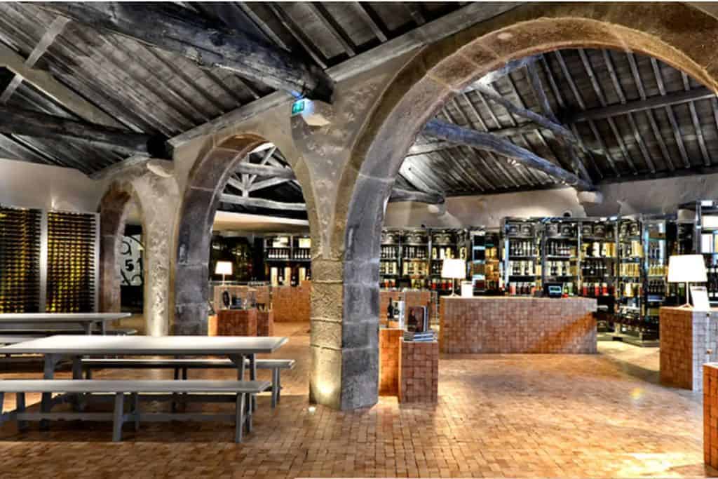 High vaulted ceilings made of stone in the Ferreira Cellars in Porto Portugal.