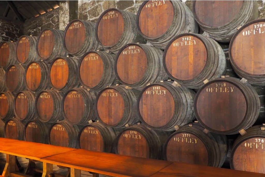 Rows of old barrels with Offley written on them in Porto, Portugal.