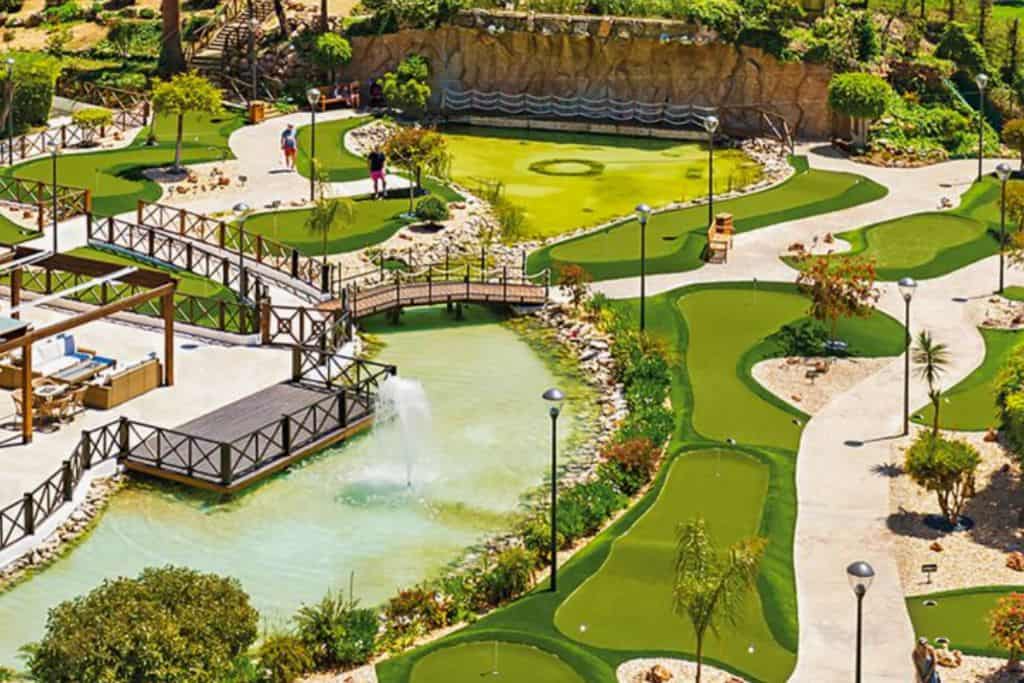In the image is the crazy golf course in Minigolf Adventure Park in Albufeira. There is no one in the image. 