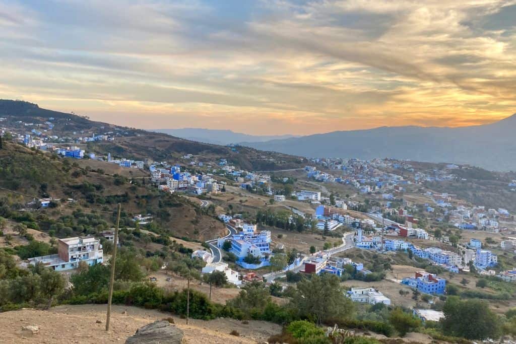 A view from up high looking out over Chefchaouen which is also called the blue city.  Many of the homes in the photo are blue.