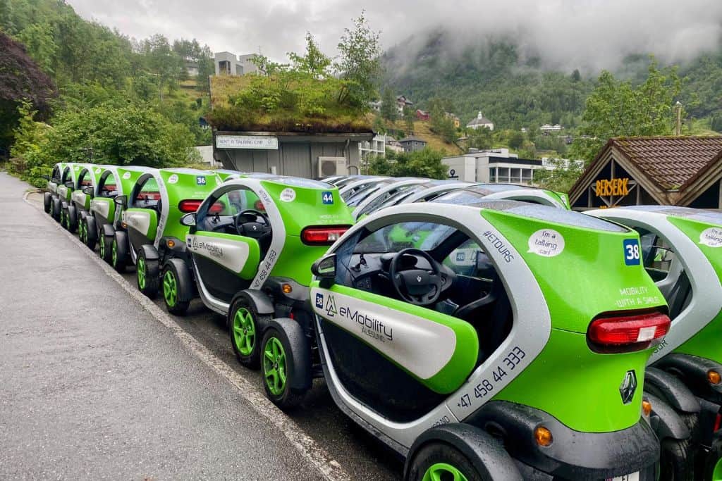 Rows of bright green Twizzle cars. 